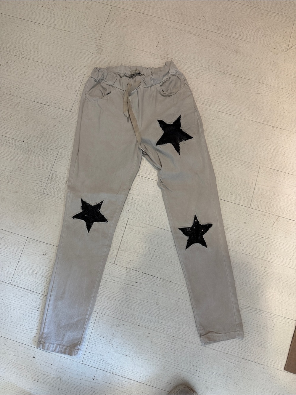 Beige Jogger Pants with Black Star Patches